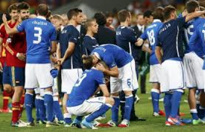  Italian players consoling one another and congratulating opponents Spain on their second consecutive European Championship